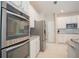 Modern kitchen with stainless steel appliances and granite countertops at 1178 Fraser Pine Blvd, Sarasota, FL 34240