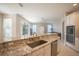 Modern kitchen with granite countertops and stainless steel appliances at 1178 Fraser Pine Blvd, Sarasota, FL 34240