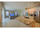 Open concept kitchen with granite island and view to living room at 1178 Fraser Pine Blvd, Sarasota, FL 34240