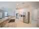 Modern kitchen with granite countertops and stainless steel appliances at 1178 Fraser Pine Blvd, Sarasota, FL 34240