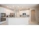 Modern kitchen with breakfast bar and granite countertops at 1178 Fraser Pine Blvd, Sarasota, FL 34240