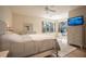 Spacious main bedroom with a king-size bed, built-in dresser, and home office at 1178 Fraser Pine Blvd, Sarasota, FL 34240
