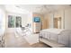 Spacious main bedroom with a king-size bed, built-in dresser, and home office at 1178 Fraser Pine Blvd, Sarasota, FL 34240
