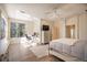 Spacious main bedroom with a king-size bed, built-in dresser, and home office at 1178 Fraser Pine Blvd, Sarasota, FL 34240