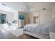 Spacious main bedroom with a king-size bed, built-in dresser, and home office at 1178 Fraser Pine Blvd, Sarasota, FL 34240