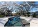 Inviting kidney-shaped pool with screened enclosure at 1178 Fraser Pine Blvd, Sarasota, FL 34240