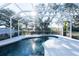 Inviting kidney-shaped pool with screened enclosure at 1178 Fraser Pine Blvd, Sarasota, FL 34240