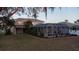 Screened-in pool with spacious deck; lush landscaping at 1178 Fraser Pine Blvd, Sarasota, FL 34240