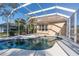 Relaxing kidney-shaped pool and screened patio at 1178 Fraser Pine Blvd, Sarasota, FL 34240