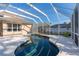 Enjoy this refreshing pool with screened patio at 1178 Fraser Pine Blvd, Sarasota, FL 34240