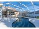 Inviting kidney-shaped pool with a screened enclosure at 1178 Fraser Pine Blvd, Sarasota, FL 34240