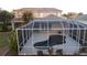 Screened-in pool with spa; landscaped backyard at 1178 Fraser Pine Blvd, Sarasota, FL 34240