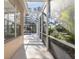 Bright screened patio with pool access and lush landscaping views at 1178 Fraser Pine Blvd, Sarasota, FL 34240