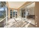Spacious screened porch with access to the living room at 1178 Fraser Pine Blvd, Sarasota, FL 34240