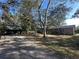 Ranch style home with a large yard and mature trees at 121 Christie Ave, Sarasota, FL 34232