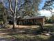 Ranch home with mature trees and a large yard at 121 Christie Ave, Sarasota, FL 34232