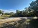 Cleared vacant lot with a partially paved area at 121 Christie Ave, Sarasota, FL 34232