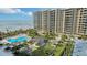 Aerial view of community pool and landscaped grounds at 1211 Gulf Of Mexico Dr # 603, Longboat Key, FL 34228