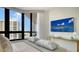 Bedroom with city views, comfortable bed and a mounted TV at 1211 Gulf Of Mexico Dr # 603, Longboat Key, FL 34228