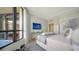Guest bedroom with a queen bed, ocean views and a balcony at 1211 Gulf Of Mexico Dr # 603, Longboat Key, FL 34228