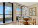 Coastal dining area with ocean views and a round table for four at 1211 Gulf Of Mexico Dr # 603, Longboat Key, FL 34228