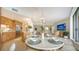 Elegant dining area with round marble table and ocean views at 1211 Gulf Of Mexico Dr # 603, Longboat Key, FL 34228