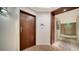 Modern condo entryway with wood door and hallway at 1211 Gulf Of Mexico Dr # 603, Longboat Key, FL 34228