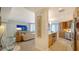 Modern kitchen with stainless steel appliances and wood cabinets at 1211 Gulf Of Mexico Dr # 603, Longboat Key, FL 34228