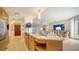 Modern kitchen with island, stainless steel appliances, and light wood cabinets at 1211 Gulf Of Mexico Dr # 603, Longboat Key, FL 34228