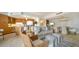 Open living area features stylish furnishings and an adjoining kitchen at 1211 Gulf Of Mexico Dr # 603, Longboat Key, FL 34228