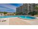 Community pool with ample deck space for relaxing at 1211 Gulf Of Mexico Dr # 603, Longboat Key, FL 34228