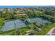 Two well-maintained tennis courts with lush landscaping at 1211 Gulf Of Mexico Dr # 603, Longboat Key, FL 34228