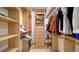 Large walk-in closet with ample shelving and hanging space at 1211 Gulf Of Mexico Dr # 603, Longboat Key, FL 34228
