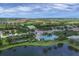 Community overview featuring pool, lake, and homes at 12810 Seasong Ter, Bradenton, FL 34211