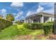 Landscaped backyard with a screened patio and lush greenery at 12810 Seasong Ter, Bradenton, FL 34211