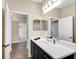Clean bathroom with single vanity and dark cabinets at 12810 Seasong Ter, Bradenton, FL 34211