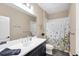 Bathroom with shower/tub combo and floral shower curtain at 12810 Seasong Ter, Bradenton, FL 34211