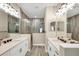 Bathroom with double vanity, walk-in shower, and tile flooring at 12810 Seasong Ter, Bradenton, FL 34211
