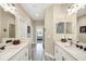 Double vanity bathroom with access to other bedrooms at 12810 Seasong Ter, Bradenton, FL 34211