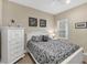 Cozy bedroom with a queen-size bed and white dresser at 12810 Seasong Ter, Bradenton, FL 34211