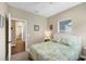 Guest bedroom with a queen bed and ensuite bathroom at 12810 Seasong Ter, Bradenton, FL 34211