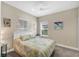 Bright bedroom with a queen-size bed and large windows at 12810 Seasong Ter, Bradenton, FL 34211