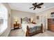 Guest bedroom with a queen-size bed, nightstands, and a dresser at 12810 Seasong Ter, Bradenton, FL 34211