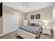 Bright bedroom with a queen-size bed and double doors at 12810 Seasong Ter, Bradenton, FL 34211