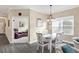 Casual dining area with a view into the living room at 12810 Seasong Ter, Bradenton, FL 34211