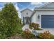 Welcoming front entry with walkway and blue shutters at 12810 Seasong Ter, Bradenton, FL 34211