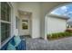 Peaceful front porch with blue bench and window at 12810 Seasong Ter, Bradenton, FL 34211