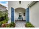 Charming front porch with blue bench and artwork at 12810 Seasong Ter, Bradenton, FL 34211