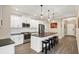 Modern kitchen with white cabinets, stainless steel appliances, and island at 12810 Seasong Ter, Bradenton, FL 34211