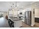 Modern kitchen with stainless steel appliances and white cabinetry at 12810 Seasong Ter, Bradenton, FL 34211